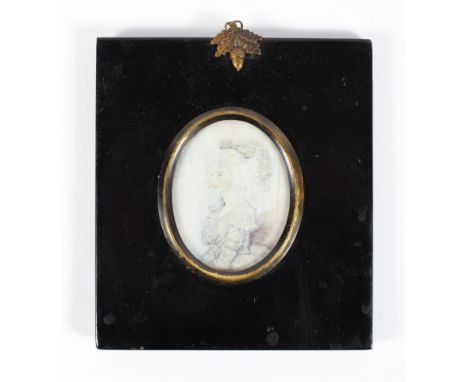 A 19th century portrait miniature, watercolour on ivory, of oval form, depicting a woman dressed in traditional costume and l