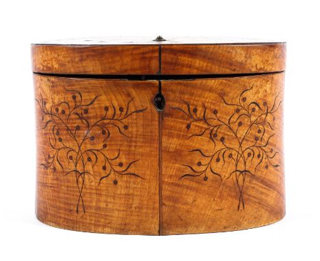 A Georgian satinwood tea caddy of oval form, the lid adorned with an inlaid fan motif, carved to front and border of lid with