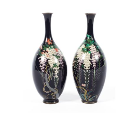 A pair of Japanese Meiji period (1868-1912) cloisonne vases, each slender oviform example decorated with trailing wisteria-ty