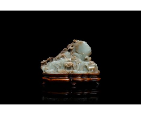 Full title: A Chinese mottled celadon and brown jade 'Eight horses of Mu Wang' carving, QingDescription: Dim.: 23 x 17,5 x 7 