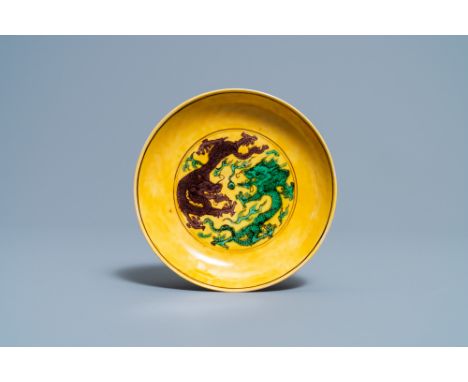 Full title: A Chinese yellow-ground green and aubergine 'dragon' dish, Kangxi mark and of the periodDescription: Dia.: 13 cmI