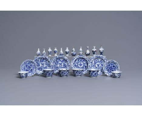 Full title: Six Chinese blue and white cups and saucers and eleven miniature vases, KangxiDescription: Dia.: 13,5 cm (the lar