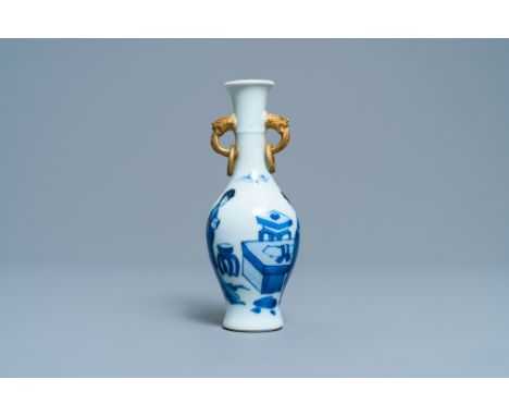 Full title: A Chinese blue and white vase with gilt elephant-head handles, KangxiDescription: H.: 17 cmÊ Condition: (UV-check