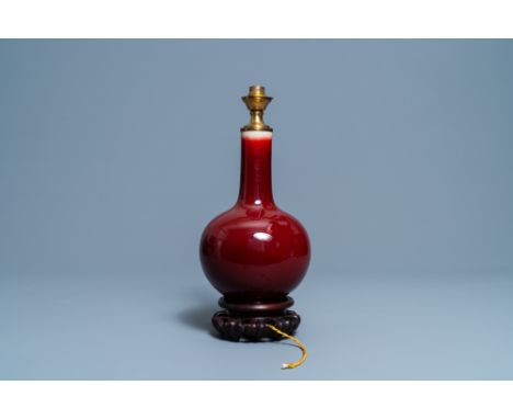 Full title: A Chinese monochrome sang de boeuf lamp-mounted bottle vase, 19/20th C.Description: H.: 39 cm (incl. the mount)H.