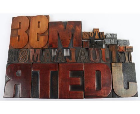A selection of vintage wooden printing letterpress blocks and metal examples, largest wooden block 130-170mm and metal 10x20m