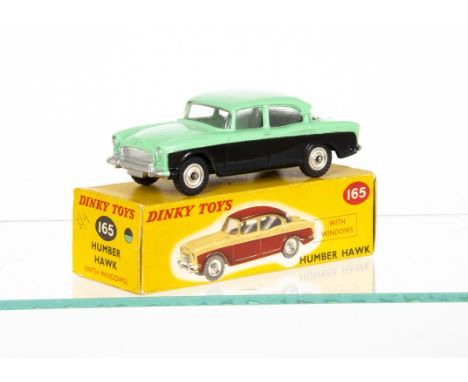 A Dinky Toys 165 Humber Hawk, green upper body and roof, black lower body, with front number plate casting, spun hubs, in ori