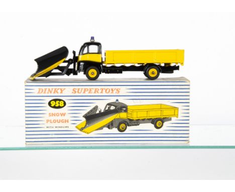 A Dinky Supertoys 958 Guy Warrior Snow Plough, yellow/black body and plough, blue roof light, yellow grooved hubs, in origina