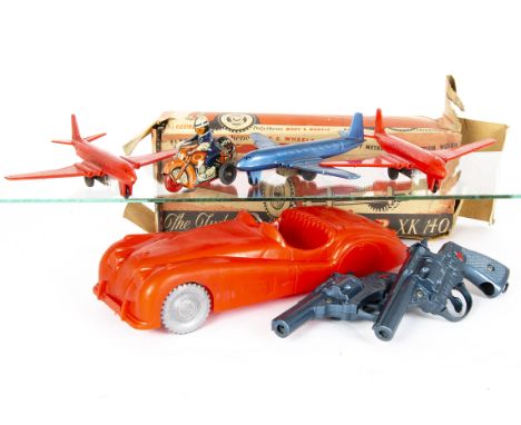 Ex-Shop Stock, large scale Tudor Rose Jaguar XK140 in red polythene with friction drive motor, in original box, with loose Lo