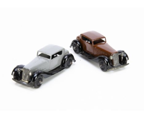 Dinky Toys 36c Humber Vogue, two examples, first dark brown body, black moulded chassis and ridged hubs, second grey body, bl