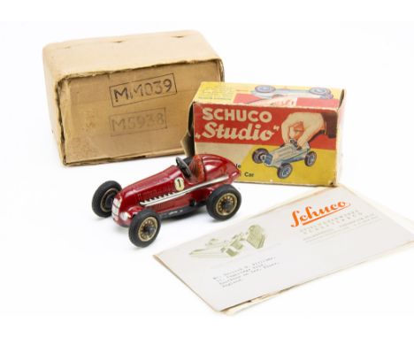 A 1930s Schuco Studio Tinplate Clockwork Racing Car, red body, RN1, with original tools and winding handle, in original box w