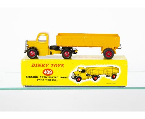 A Dinky Toys 409 Bedford Articulated Lorry, late issue with yellow cab, silver grille, window glazing, deep yellow trailer, r