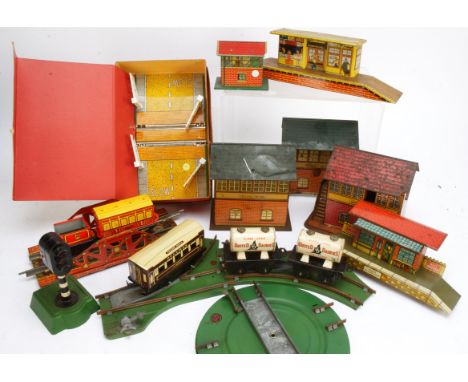 Wells-Brimtoy and Other O Gauge Tinplate Accessories, including two Wells 'United Dairies' tank wagons, small Brimtoy BR tend