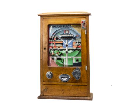 A Wondermatics Allwin Penny Slot Machine 'Win And Place', c 1954, in oak case, approx 780 x 500mm, with two sets of keys, G, 