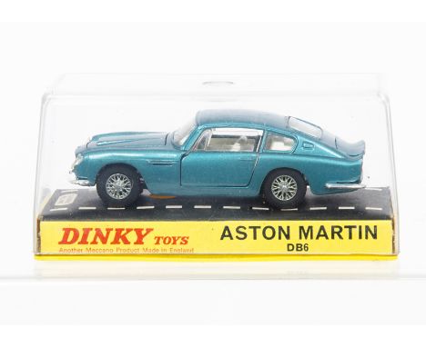 A Dinky Toys 153 Aston Martin DB6, metallic turquoise body, white interior, cast spoked wheels, in original hard plastic case