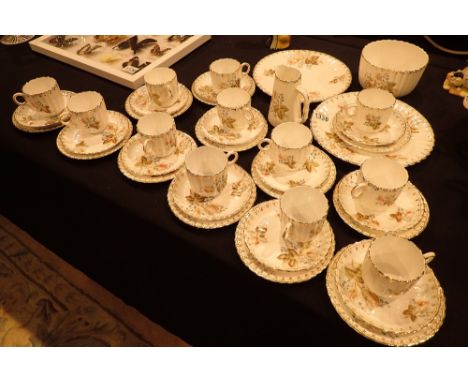 Victorian tea service with fluted cups and floral design 