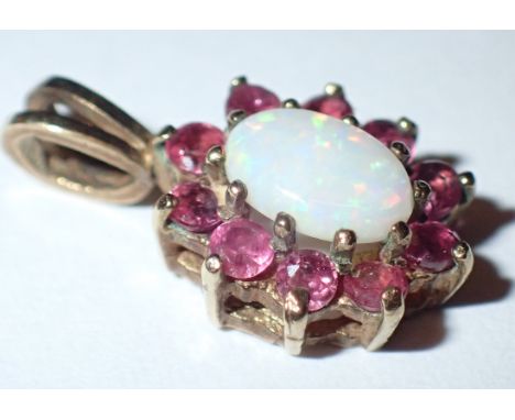 9ct gold opal and ruby pendant CONDITION REPORT: 9mm pendant, no damage to the stones.