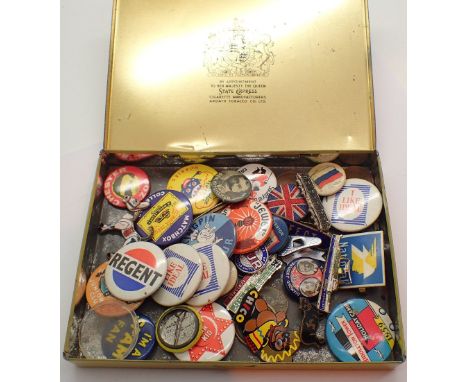 Tin of vintage pin badges including some enamelled examples 