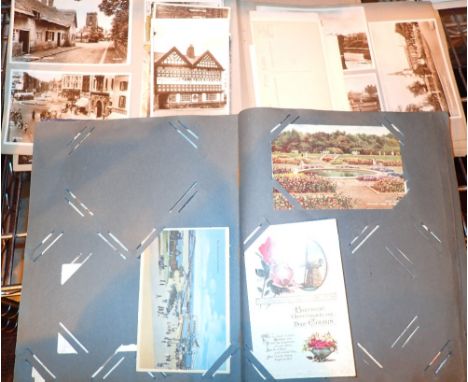 Two albums of vintage postcards and photographs 