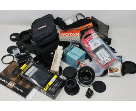 Mixed camera lenses and camera accessories including Olympus and Canon. P&amp;P Group 2 (£18+VAT for the first lot and £3+VAT