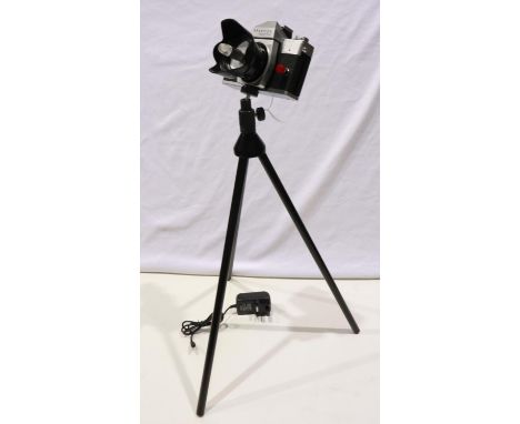 LED camera lamp, made from a Praktica Super TL2 camera with power supply and tripod about 60cm tall, working at lotting. P&am