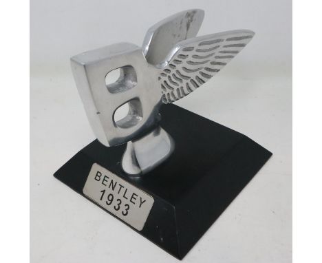 Polished aluminium Bentley B on a base, H: 13 cm. UK P&amp;P Group 2 (£20+VAT for the first lot and £4+VAT for subsequent lot