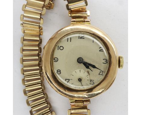 Ladies 9ct gold 15 jewel wristwatch on a yellow metal bracelet, inscribed 9ct, total 21.1g, not working at lotting. UK P&amp;