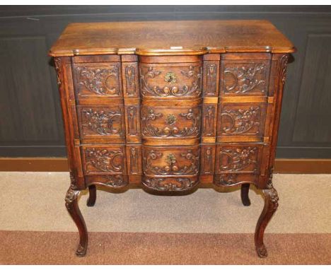 OAK CHEST OF 18TH CENTURY FRENCH PROVINCIAL DESIGN 
the shaped front with three scroll moulded drawers below on tall cabriole
