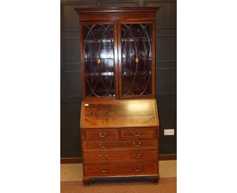 EDWARDIAN MAHOGANY SHERATON REVIVAL BUREAU BOOKCASE 
the moulded cornice with adjustable shelving below enclosed by two astra