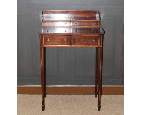 EDWARDIAN MAHOGANY AND SATINWOOD LINE INLAID LADY'S WRITING TABLE
with two drawer gallery above two short drawers, all on fou