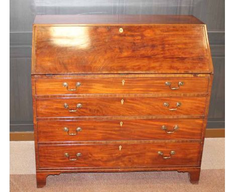 REGENCY MAHOGANY WRITING BUREAU
the fall front opening to reveal a birds eye maple interior over four cockbeaded graduated lo