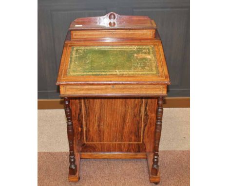VICTORIAN ROSEWOOD DAVENPORT WRITING DESK 
the raised back with stationary compartment, fall front writing surface inset with