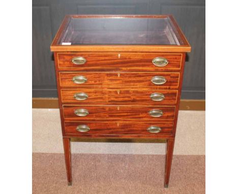 EDWARDIAN CURIO CABINET
the hinged top with a bevelled glass panel revealing the display area below, two deep drawers beneath