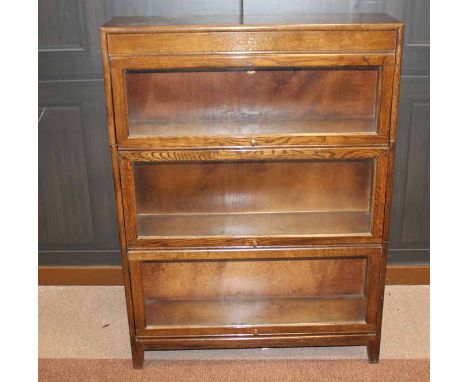 OAK THREE SECTION STACKING BOOKCASE
the top section stencilled with the Acorn trade mark, on bracket feet, 87cm wide