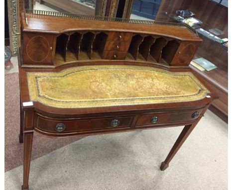MAHOGANY WRITING DESK OF CARLTON HOUSE DESIGN
the raised back fitted cupboards, pigeon holes and small drawers, inset leather