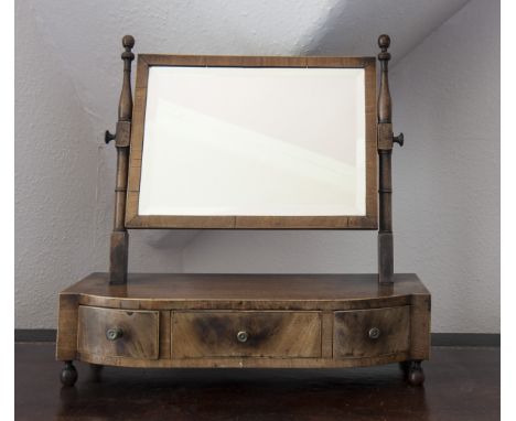 19TH CENTURY MAHOGANY OBLONG DRESSING GLASS 
with turned upright, on a bowed box base fitted three drawers, on turned feet, 5