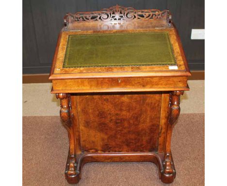 VICTORIAN WALNUT DAVENPORT WRITING DESK 
with fretted pediment, the slope inset with tooled leather writing surface, with fou