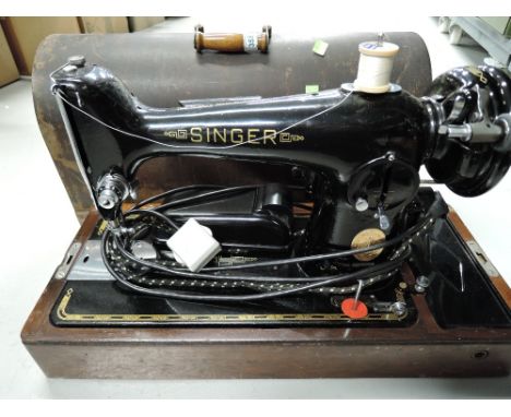 A vintage Singer sewing machine electric belt driven 