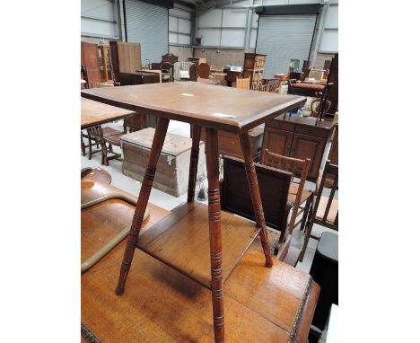 An early 20th Century occasional table on splay legs