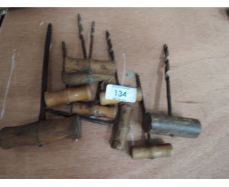 A selection of vintage cork screw and wood bores 