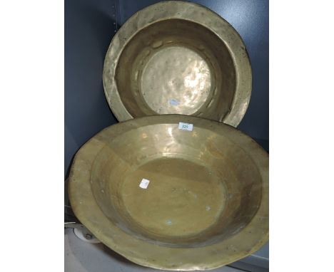 Two vintage large brass beaten shaving or wash bowls