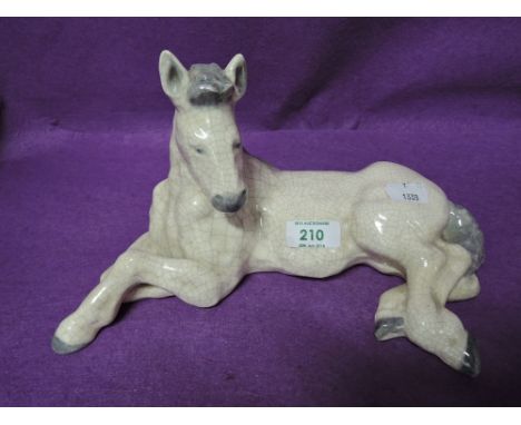 A vintage figure of a horse with crackle glaze