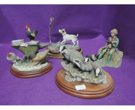 A selection of vintage figures and figurines in a Boarder Fine Arts style