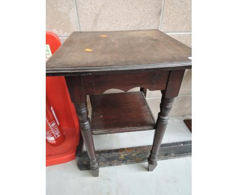 An early 20th century oak side table