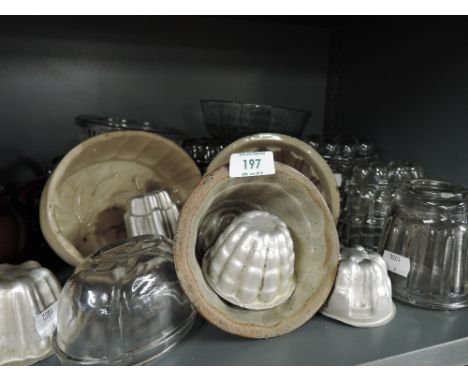 A selection of vintage kitchen items including small jelly moulds etc