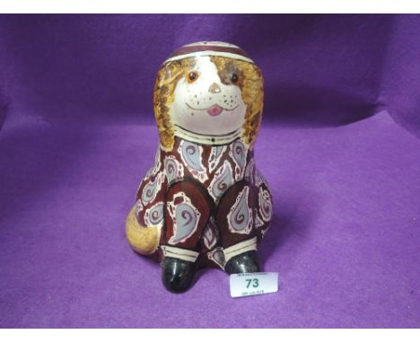 A vintage ceramic dog figure with hand decorated bohemian print marked c 121 Cherry Scott Keswick 1991