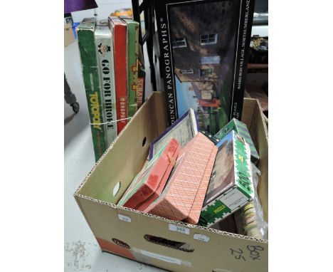 A selection of vintage children board games and puzzles 