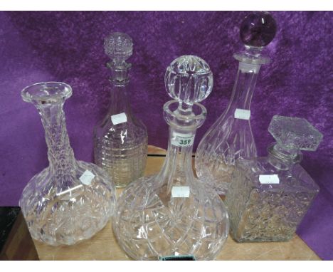 A selection of vintage clear cut and crystal decanters
