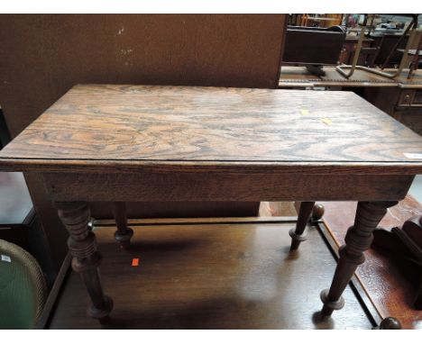 A traditional part oak coffee table
