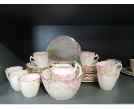 A Victorian part tea service by Wileman Foley in the Kensington Pattern No5022, in the Lily shape circa 1893, pink and gold f