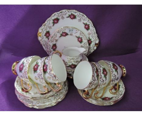 A selection of vintage tea cups and saucers by Roslyn fine China